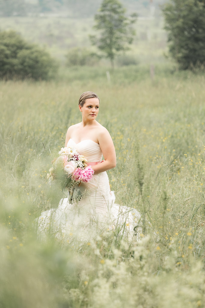 bride standing in a field, eloping in vermont