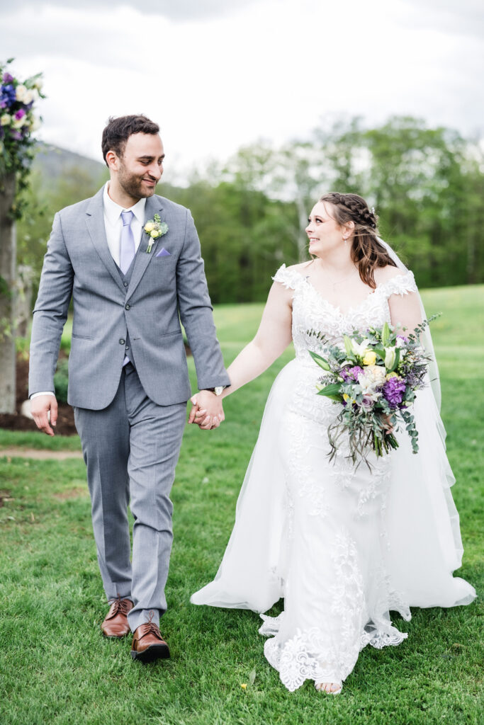 vermont wedding photographer capturing couple walking 